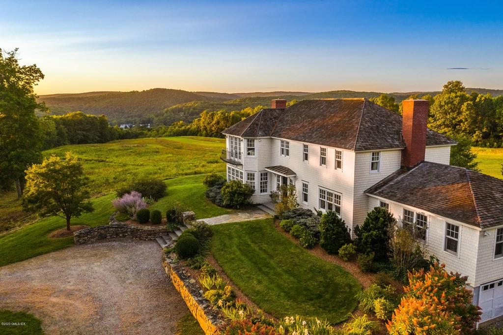 On the market Washington Depot colonial with private helipad sits on