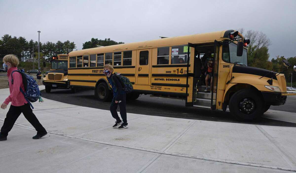 Students head into Ralph M. T. Johnson Elementary School in Bethel, Conn., for in-person learning Sept. 29, 2020.