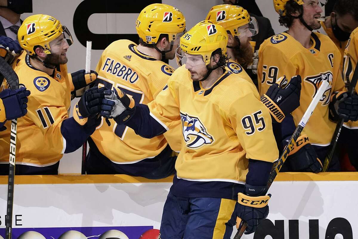 Nashville teammates congratulate center Matt Duchene (95) after his backhand goal lifted them to a win over Chicago in a shootout, the second straight night the teams needed extra time.