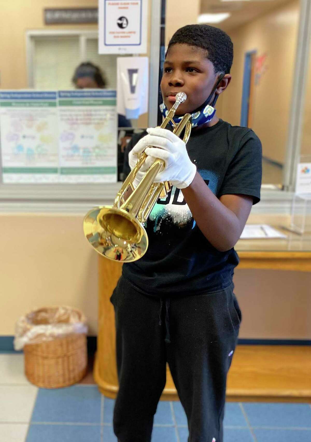Ponderosa Elementary student Jaron Collins with his new trumpet, given to him by an anonymous faculty member.