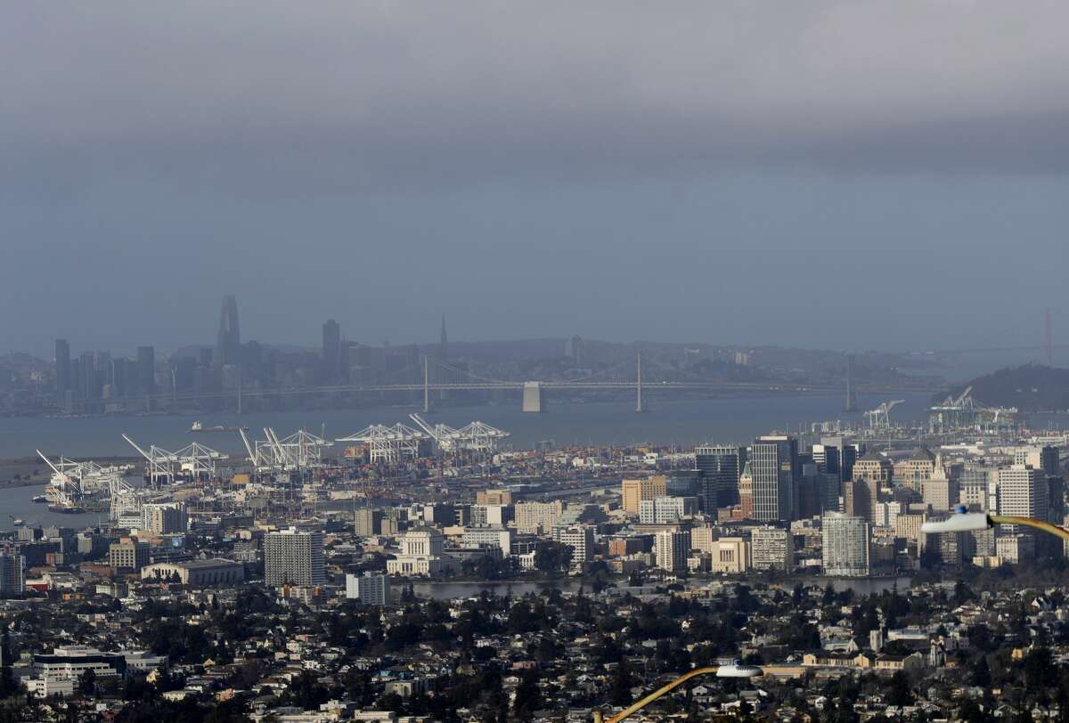 A view of downtown Oakland and San Francisco are seen from Skyline Boulevard as clouds hang over after a rain and wind storm in Oakland, Calif., on Wednesday, Jan. 27, 2020.