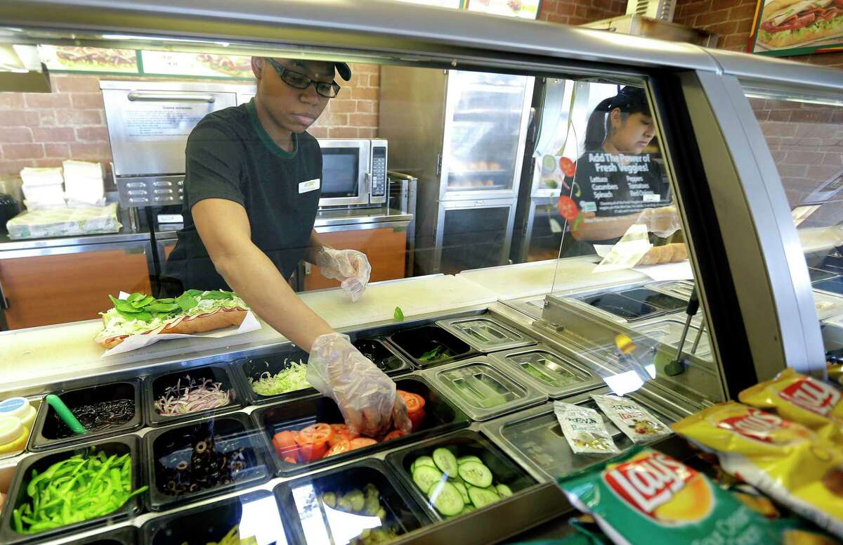 Subway staff in 2015 at a sandwich shop in Seattle. In January 2021, California plaintiffs retained a major law firm to oversee a lawsuit against Milford, Conn.-based Subway, claiming that tuna sandwiches purchased at an unspecified number of California shops contained no tuna which the company disputes.