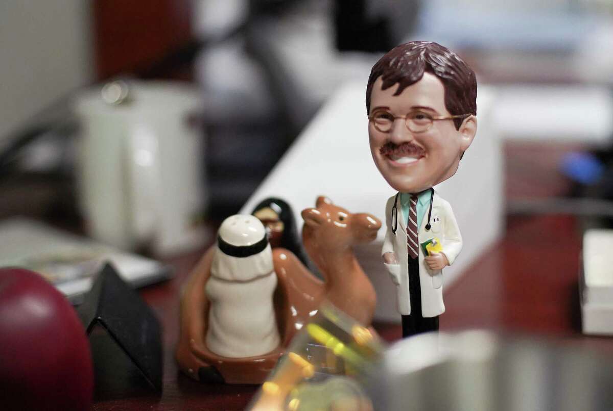 Chachkies on Dr. Peter Hotez's desk include a bobble head made in his liking at his Baylor office in Houston on Thursday, Jan. 28, 2021.