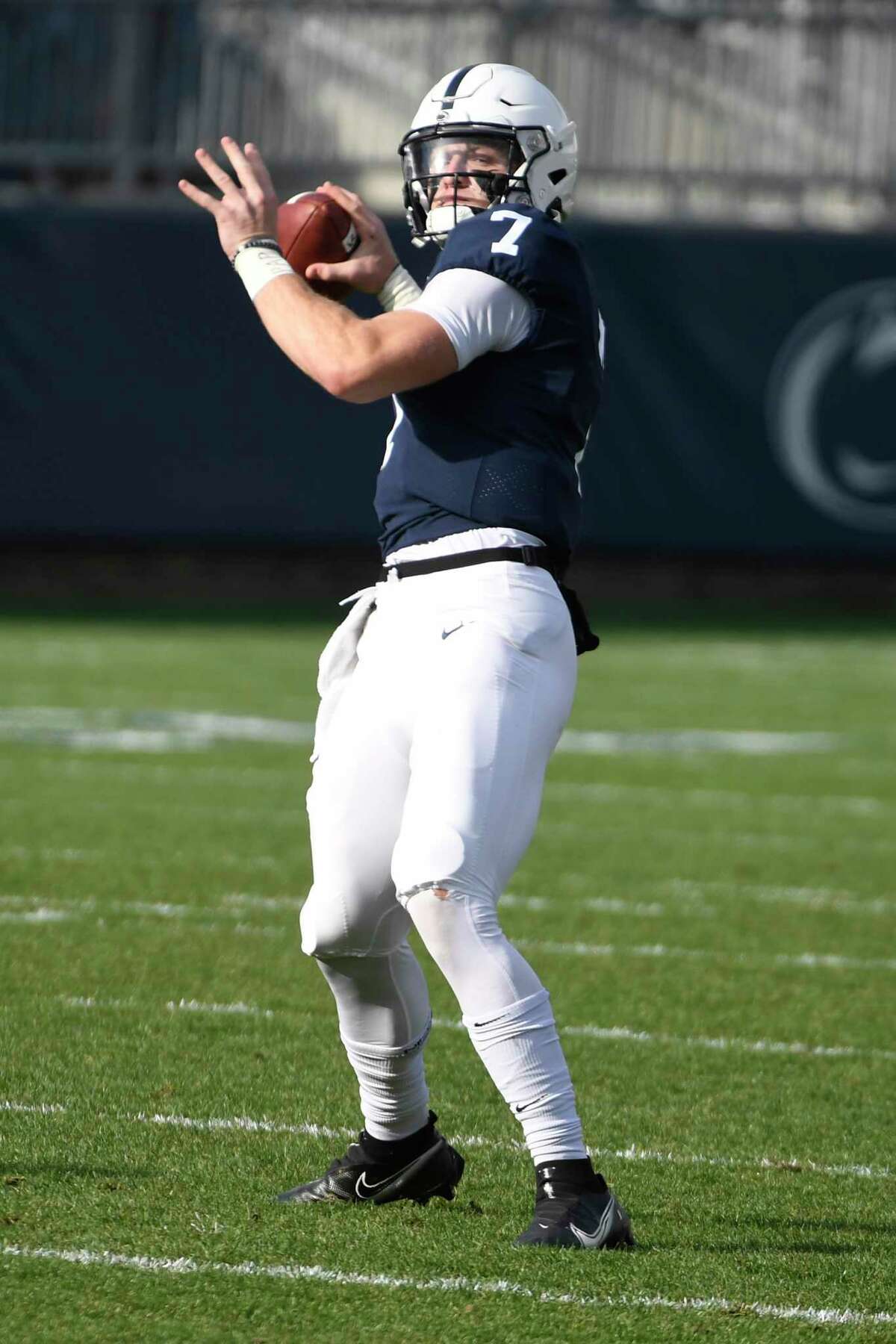 Penn State quarterback Will Levis (7) warms up for an NCAA college football game against Michigan State in State College, Pa., on Saturday, Dec. 12, 2020.