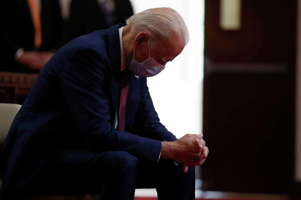 Joe Biden bows his head in prayer as he visits Bethel AME Church in Wilmington, Deleware, on June 1, 2020.