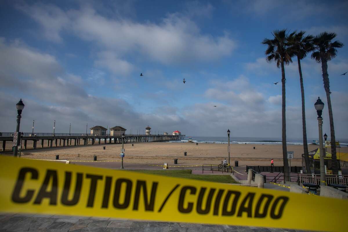 Huntington Beach, California is virtually empty on May 02, 2020. - Orange County beaches will remain closed after a California Superior Court judge rejected a request May 1 to block California Governor Gavin Newsom's order to close local beaches during the coronavirus pandemic. (Photo by Apu GOMES / AFP) (Photo by APU GOMES/AFP via Getty Images)