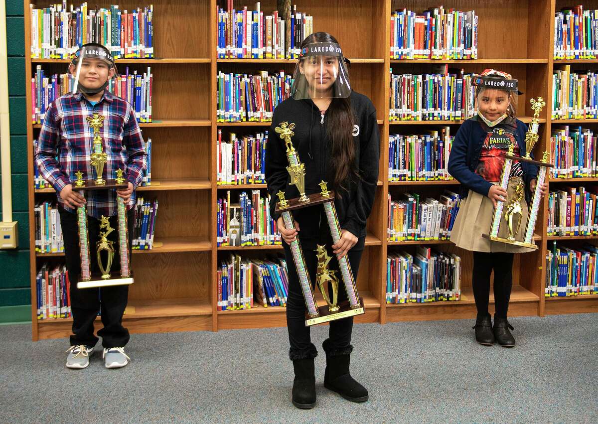 LISD’s virtual Spelling Bee was won by Lamar Middle School eighth grader Mia Cuevas, center, who won for the fourth straight year. Others finishing in the top three included second-place Alfredo Vasquez of K. Tarver Elementary School, left, and third-place Victoria Salazar of Lamar Middle School, right.