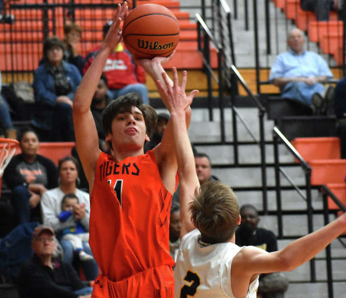 Edwardsville’s Brennan Weller puts up a shot from the corner during the Class 4A Edwardsville Regional championship game against O’Fallon last season.