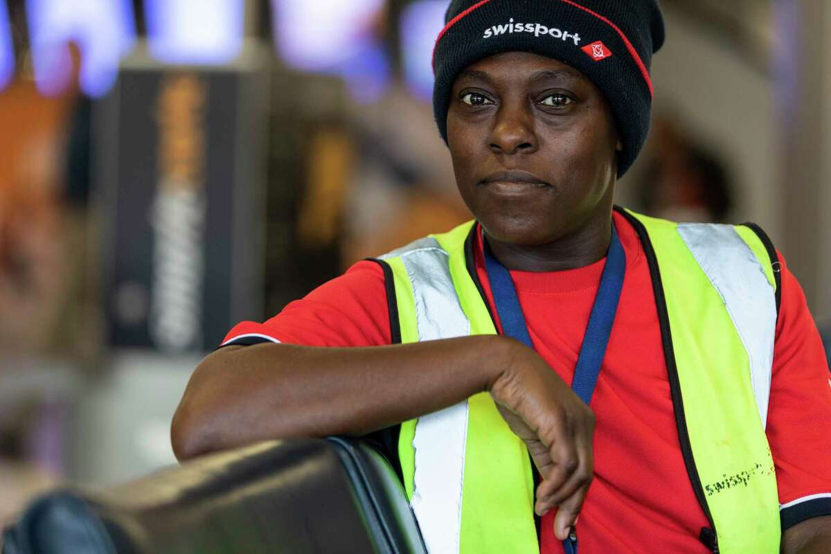 Quintina Moore-Caraway, an airport worker, at George Bush Intercontinental Airport in Houston, Oct. 19, 2019. A minimum wage of $12 an hour at the airport takes effect this year; some there made less than $9 two years ago. (Michael Starghill Jr./The New York Times)
