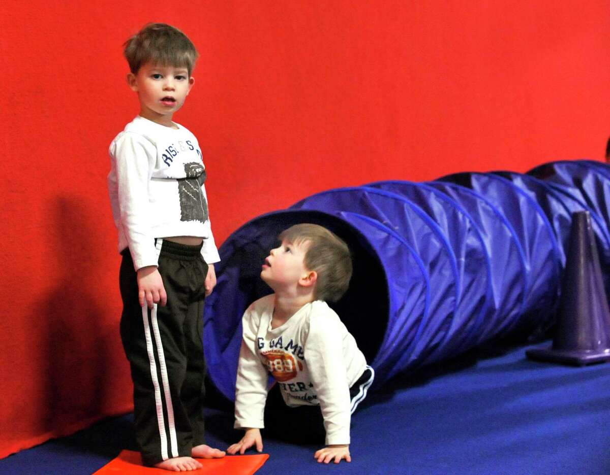 Nicholas Miller looks up to his brother, Caleb Miller, both 3, of Ridgefield, as Caleb looks toward their mom during Tumble Bear class at the Gymnastic Spectrum in Danbury, during a previous year. Boys, and girls are invited to sign up for FLIPS Tumbling classes at the Ridgefield Recreation Center starting March 1. Led by former Walt Disney World stuntman Phil Fotopoulos, this program is great for cheerleaders, gymnasts and break dancers. Students, in kindergarten through the fifth grade, meet on Mondays from 4:30 p.m to 5:30 p.m. Students, in the fourth through the 12th grade, meet on the Mondays from 5:45 p.m. to 6:45 p.m. Groups will be divided according to age and skill level.