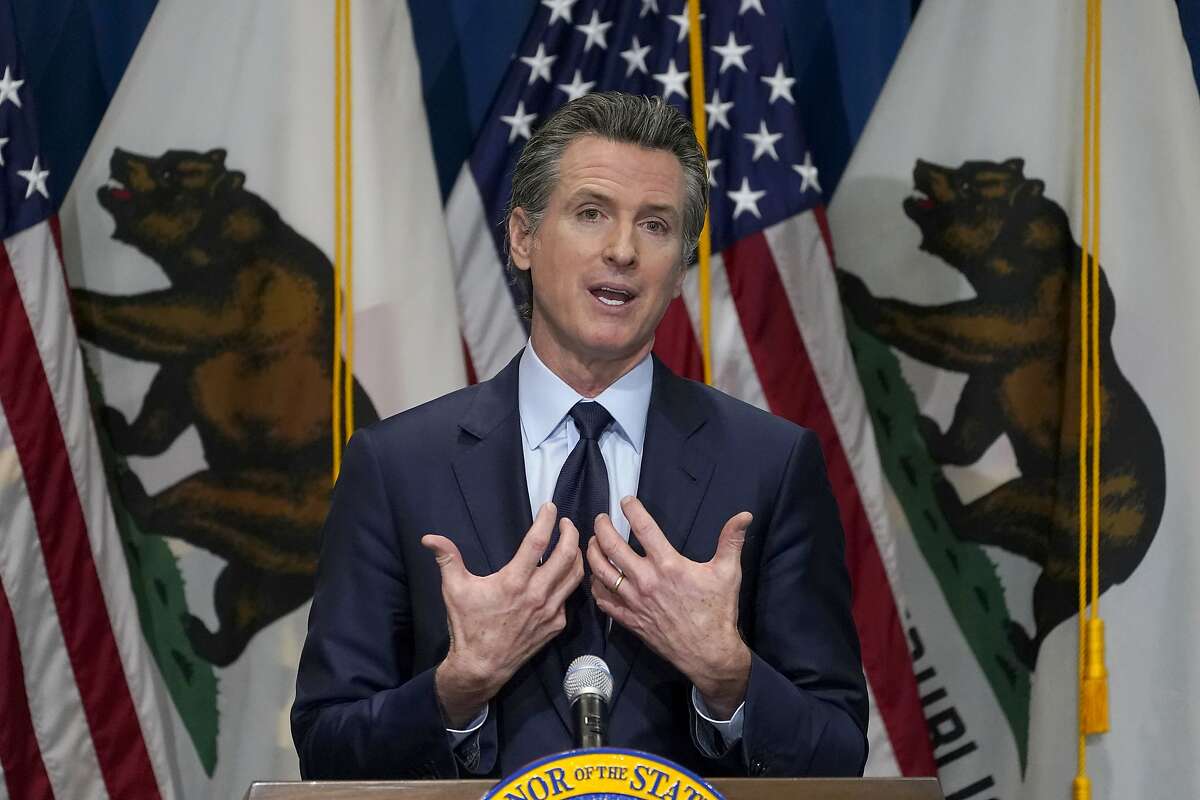 FILE - In this Jan. 8, 2021, file photo, California Gov. Gavin Newsom outlines his 2021-2022 state budget proposal during a news conference in Sacramento, Calif. A scathing state audit released Jan. 28, 2021, blames Newsom's administration for "significant missteps and inaction" that cost taxpayers at least $10.4 billion to unemployment insurance fraud. (AP Photo/Rich Pedroncelli, Pool, File)