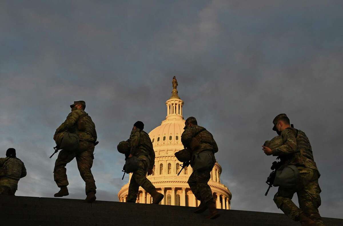 Members of the National Guard outside the U.S. Capitol at sunrise on Jan. 19.