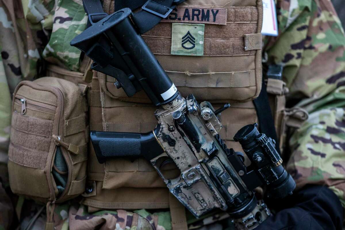 National Guard stand watch at the U.S. Capitol on Thursday, a day after the Department of Homeland Security issued a bulletin warning of a continued threat from domestic violent extremists.