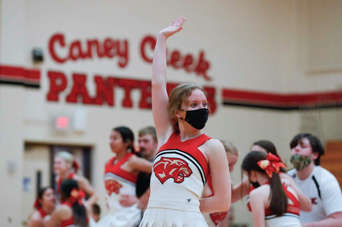 Caney Creek High School cheerleader Crystal Slater performs a contest routine with teammates, Thursday, Jan. 28, 2021, in Grangerland. The team finished fourth in the Coed division of the UIL State Spirit Championships on Jan. 13 in Fort Worth.
