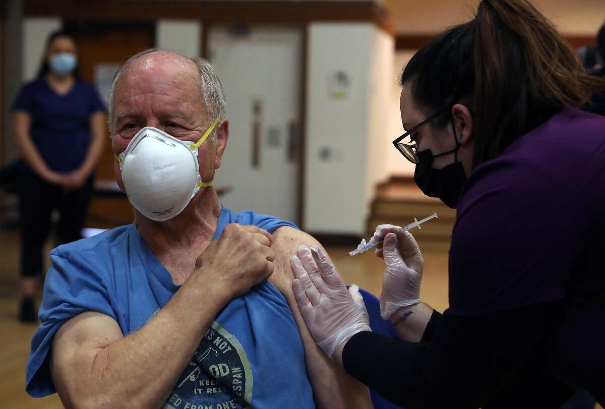 Rad Sommer of Sebastapol, 74, receives a COVID-19 vaccination at the Rohnert Park Community Center.