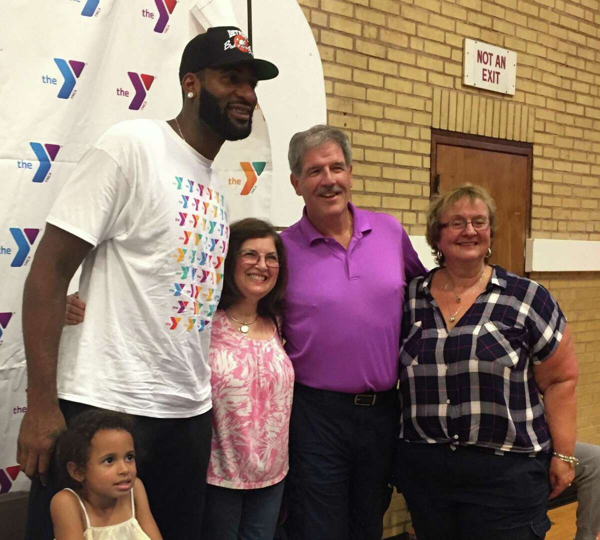 Middletown native and NBA center for the Detroit Pistons Andre Drummond is shown with his Bielefield Elementary School fourth-grade teacher Marty Skelly at a Boston vs Detroit game in December 2019.  NBA star Andre Drummond is shown at the Middletown YMCA after donating 400 backpacks to the kids there. Also shown are former Bielefield principal Renata Lantos, retired fourth-grade teacher Sharon Goodwin and Bielefield principal Suzanne Shippee Lopez.