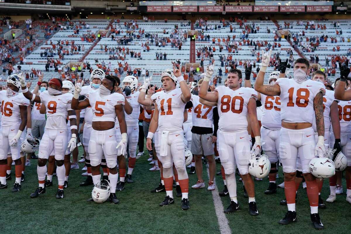 Texas football players sing the “Eyes of Texas” after a win last season against Baylor.