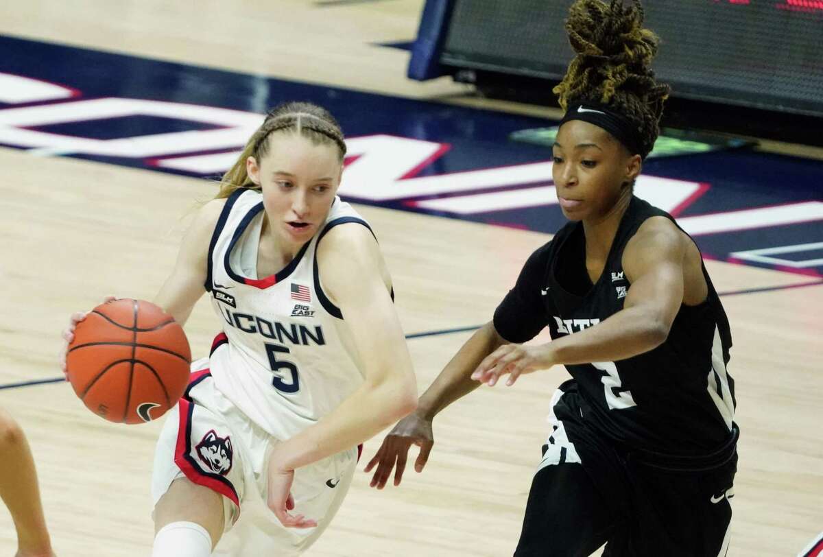 UConn's Paige Bueckers (5) drives to the basket against Butler's Genesis Parker (2) during a January game in Storrs.