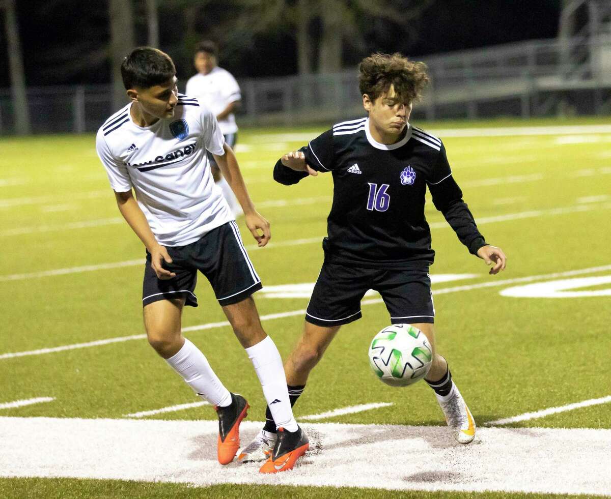 New Caney Alan Torres (20) and Montgomery Sabastian Rodriguez (16) fight for control of a throw-in during the first period of a District 20-5A high school soccer match at Montgomery High School, Friday, Jan. 29, 2021, in Montgomery.