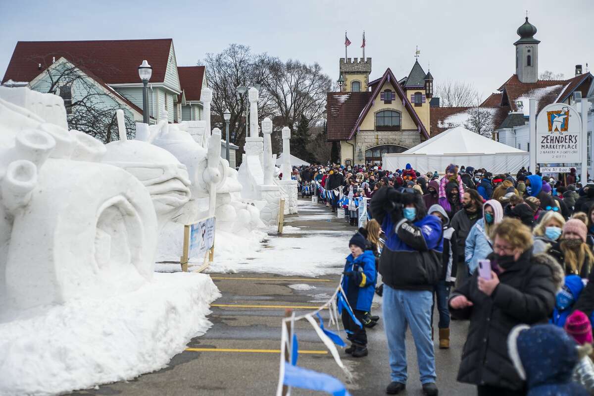Thousands of people check out sculptures made of ice and snow during the annual Zehnder's Snowfest Saturday, Jan. 30, 2021 in Frankenmuth. (Katy Kildee@mdn.net)