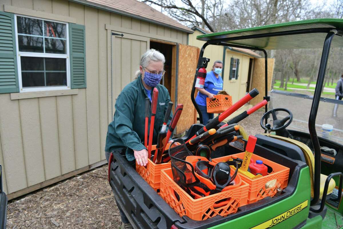 Rowena Ochiagha (left) and Pamela Ball loads tools and supplies during a workshop for residents to connect with nature and learn more about environmental conservation. The workshop took place at the Headwaters at Incarnate Word Saturday morning.