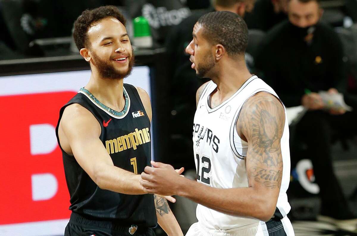 Kyle Anderson, left, who played for the Spurs from 2014-18, entered Monday night’s game averaging 12.8 points, 7.1 rebounds and 3.9 assists — all career highs — for Memphis.