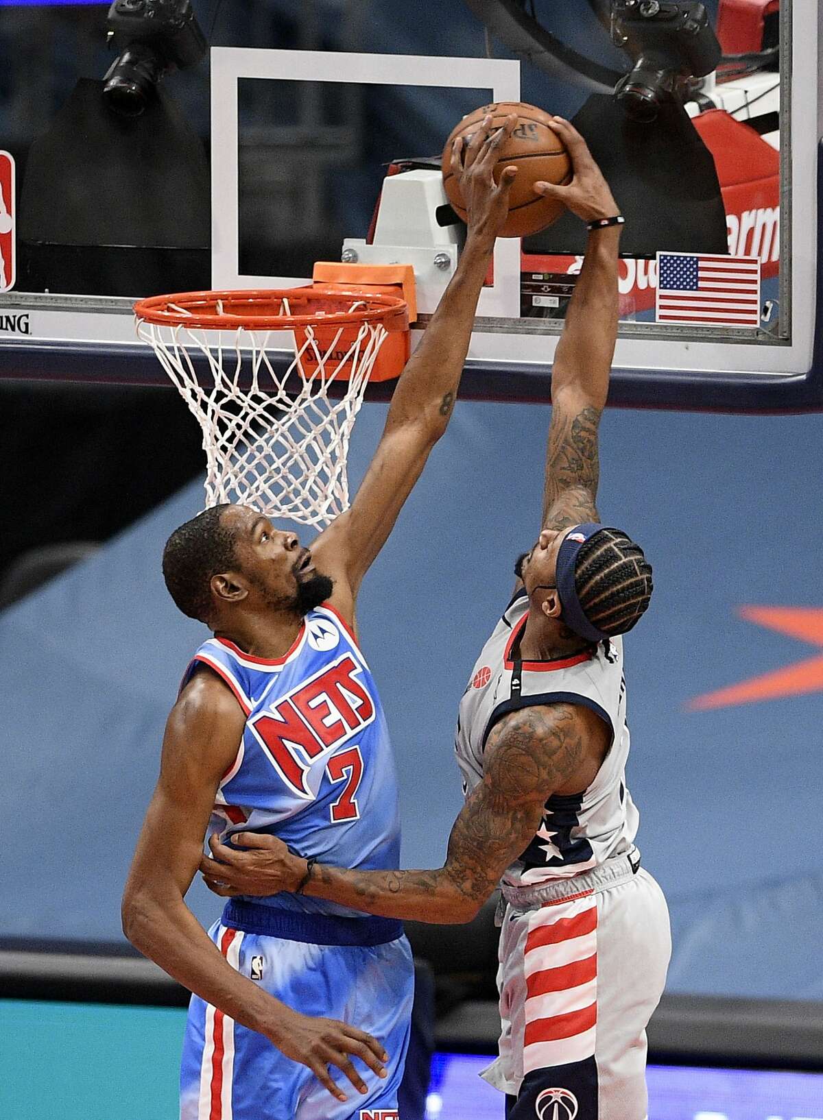 Washington guard Bradley Beal goes to the basket as Brooklyn forward Kevin Durant defends. Each scored 37 points.