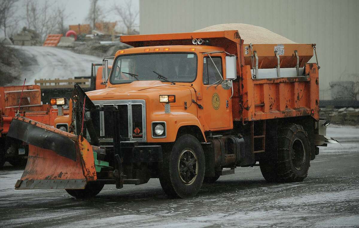 Loaded for the storm, a plow truck heads out on the road from Fairfield Public Works in Fairfield, Conn. on Tuesday, January 21, 2014.