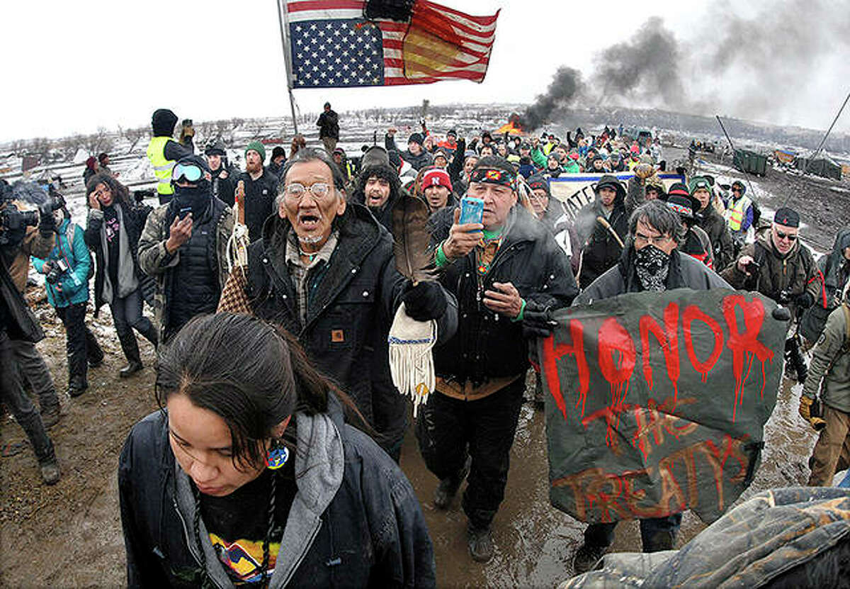 A crowd representing a majority of the remaining Dakota Access Pipeline protesters march near Cannon Ball, North Dakota, in 2017.