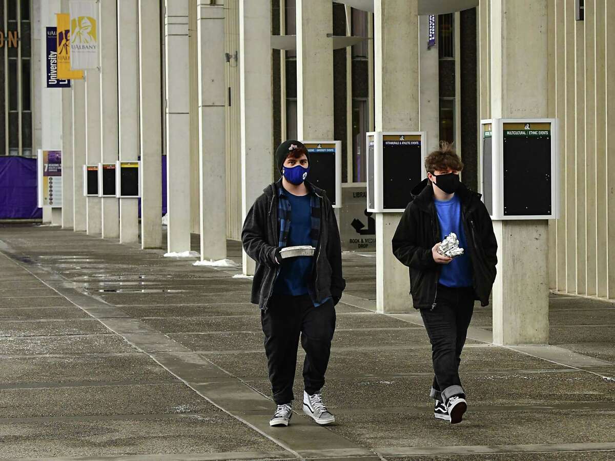 Students are seen walking on campus as classes resume at University at Albany Monday, Feb. 1, 2021 in Albany, N.Y. (Lori Van Buren/Times Union)