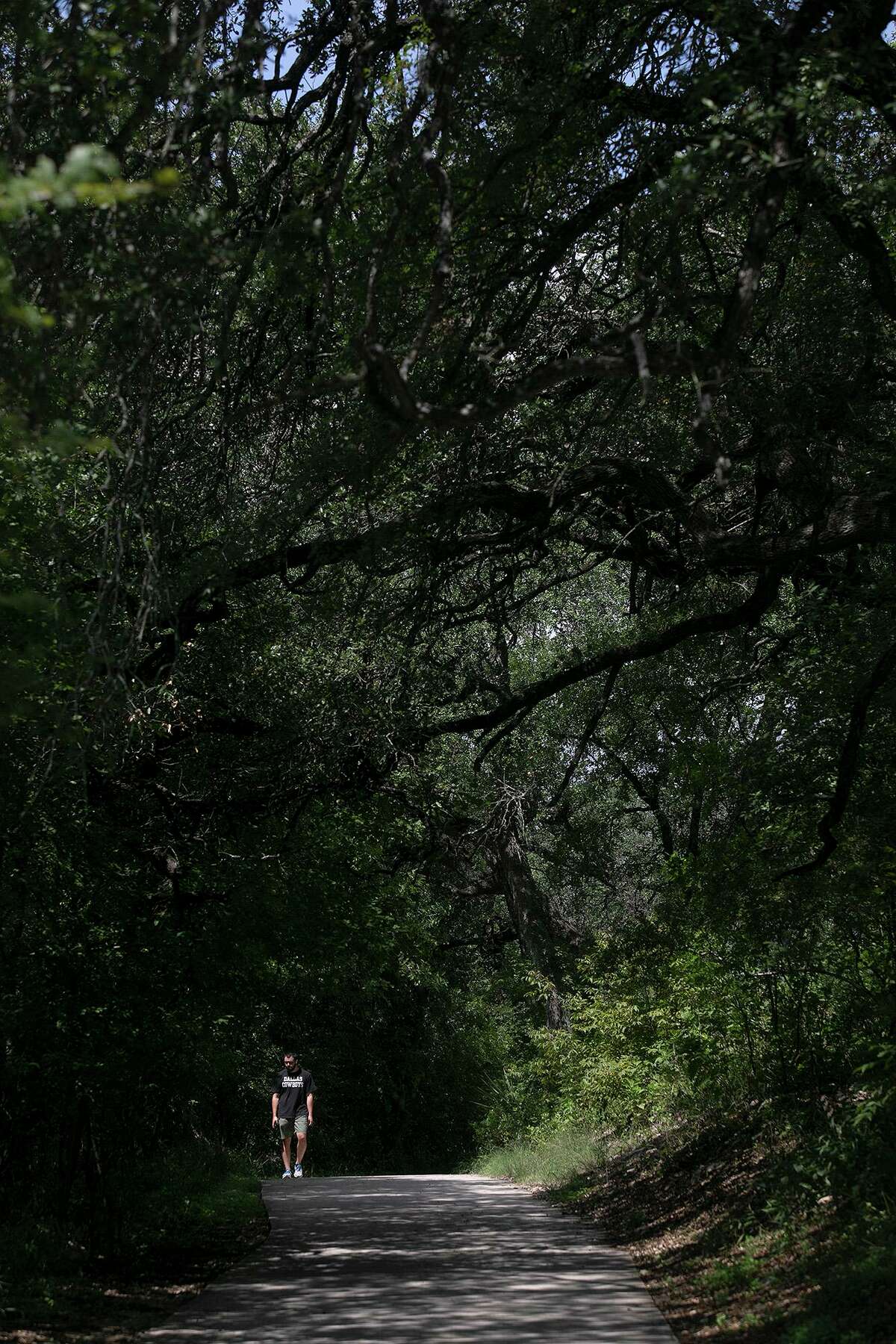 Ruben Perez walks south on the Leon Creek Greenway, just north of the Valero Trailhead, on Sept. 18, 2020.