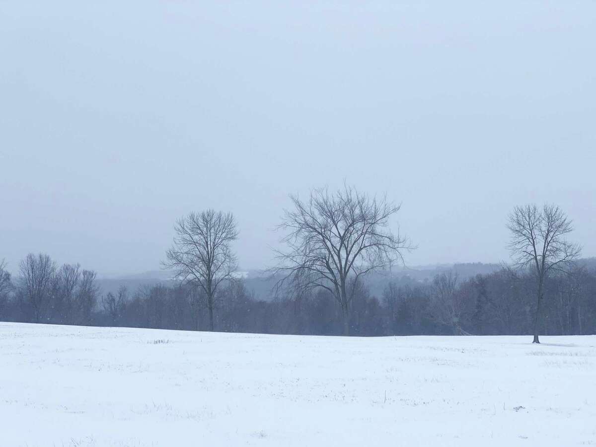 Snow blowing acress a hay field on Thomson Road in Bethlehem