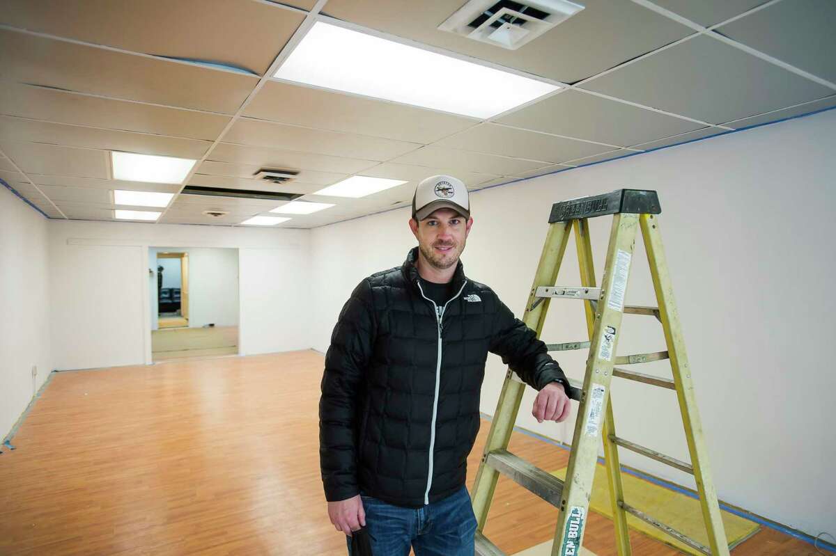 Chris Welch, owner of Aviator Cookie Company, poses for a portrait Monday morning at the store, which Welch hopes to open in March. (Katy Kildee/kkildee@mdn.net)