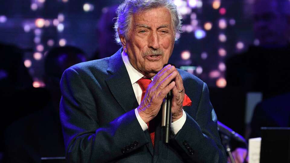 FILE - Singer Tony Bennett performs at the Statue of Liberty Museum opening celebration in New York on May 15, 2019. Bennett has been diagnosed with Alzheimer's disease but the diagnosis hasn't quieted his legendary voice. The singer's wife and son reveal in the latest edition of AARP The Magazine that Bennett was first diagnosed in 2016. (Photo by Evan Agostini/Invision/AP, File)