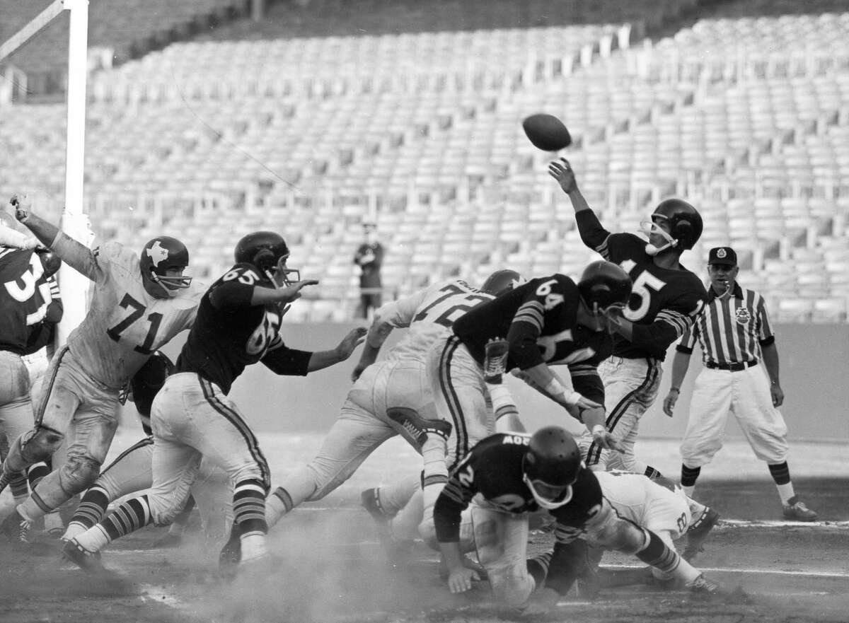 Oakland Raiders quarterback Tom Flores passes the ball during a game against the Dallas Texans at Candlestick Park on Sept. 24, 1961.