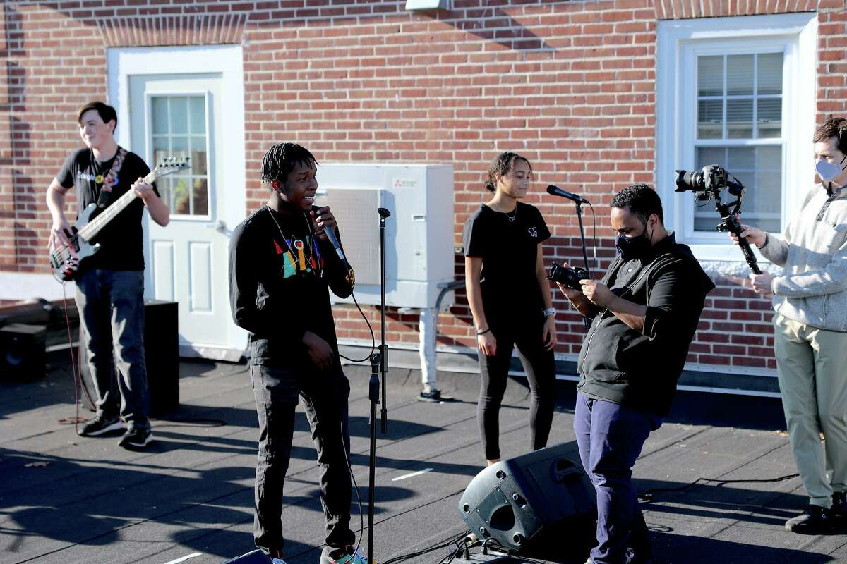 A music video titled: “Times Like These,” and featuring the St. Luke’s School’s in New Canaan Blues Band members, and was recently filmed on the school’s rooftop, premiered at the school’s 19th State of the School address on Thursday, November 19, 2020, and seems destined to go down in history as one of the coolest things a school has ever done. (From right) are: St. Luke’s School Senior student Brian Douglas Class of 2021, the school’s Academic Technologist, Eli Fendelman, A/V Specialist Bryan DeVissiere and the school’s Blues Band.