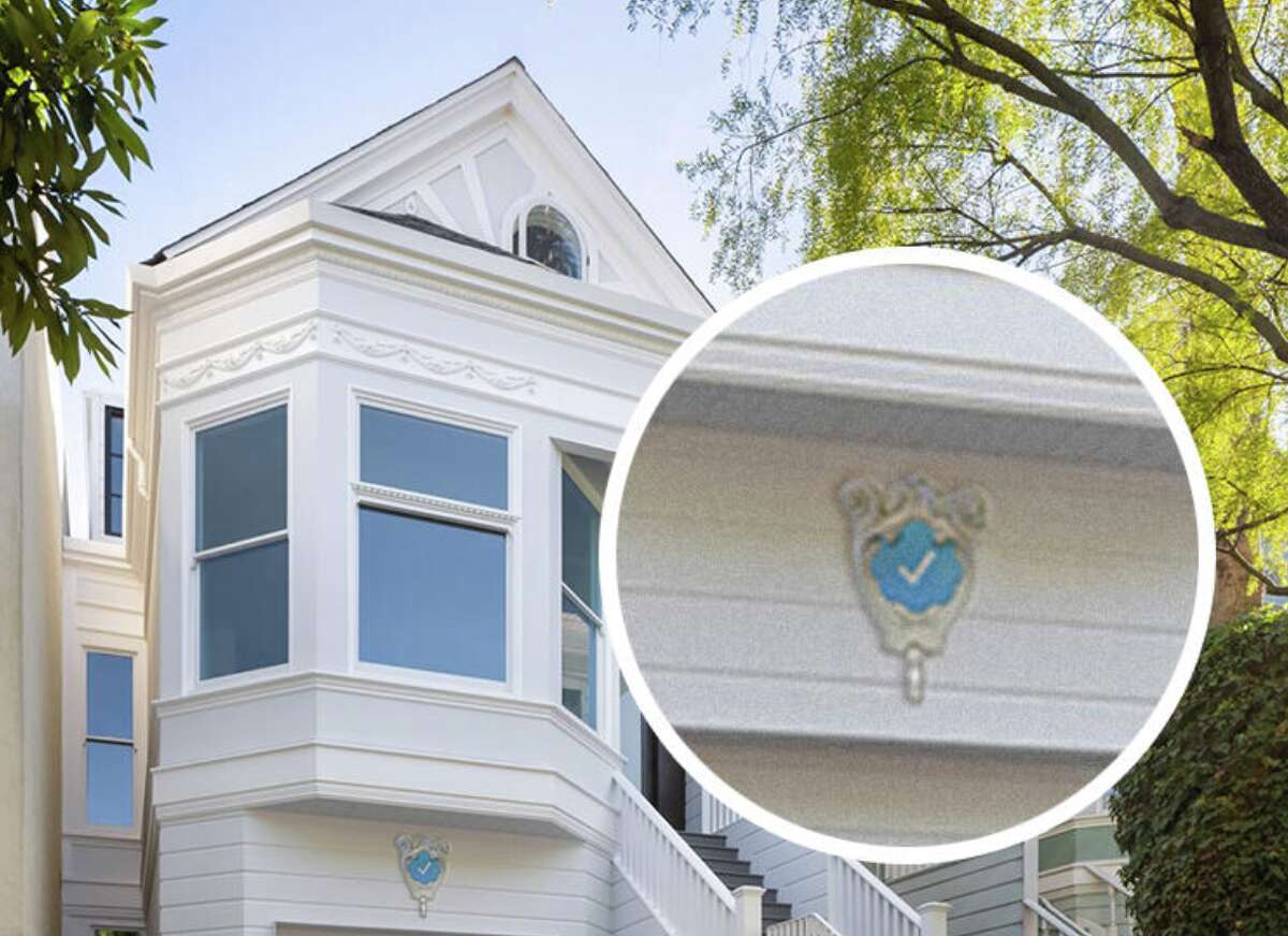 "Blue Check Homes," a satirical website crafted by San Francisco artist Danielle Baskin, unexpectedly encouraged hundreds of residents to apply to have a "Verified Badge crest" installed on the facade of their homes.