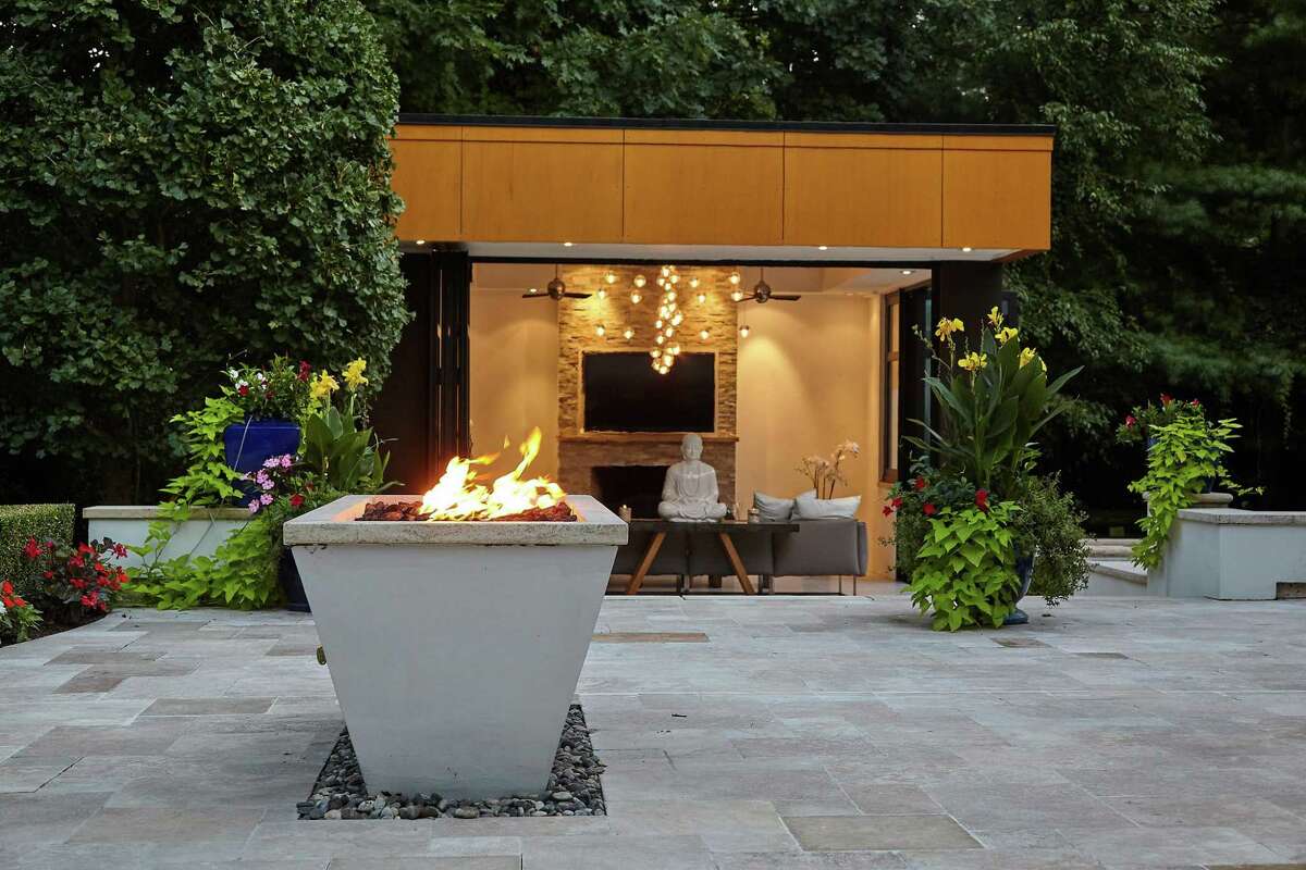 Glass serenity house with fireplace at 17 Woodway Lane, Westport.