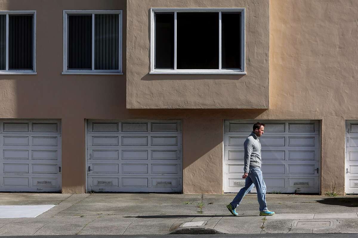 Justin Welter, Anza Vista neighborhood resident, walks along Fortuna Avenue in front of a building, where 84-year old Vicha Ratanapakdee suffered injuries that he later died from. The 19-year-old accused of shoving Ratanapakdee pleaded not guilty to murder and elder abuse charges.
