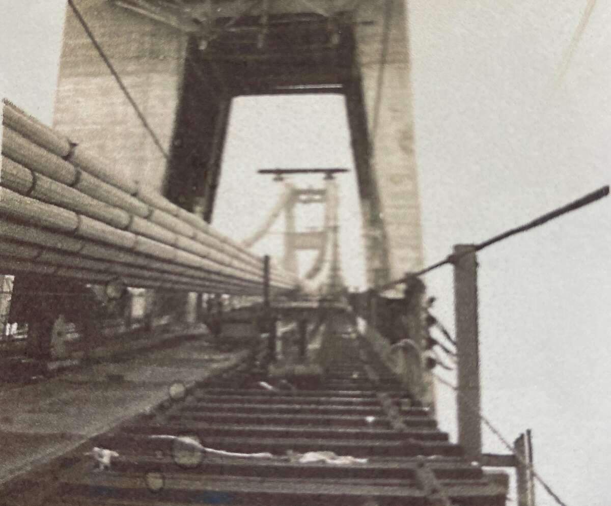 George Dondero snuck past a guard in 1935 and walked up the catwalk of the Golden Gate Bridge, taking photos of the partially finished landmark along the way.