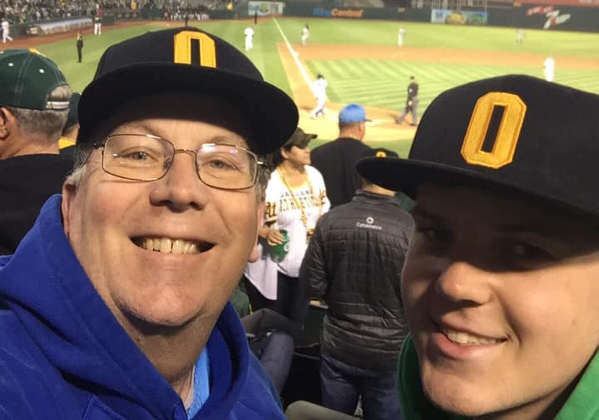 Photograph of Terry Gilliam at A's match with his son.