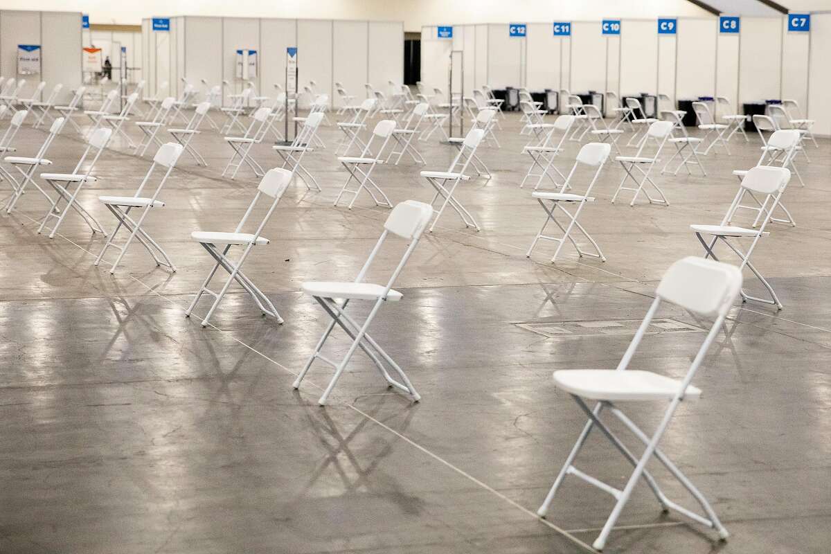 Chairs are set up in a socially distanced manner at a new COVID-19 vaccination site at Moscone South in San Francisco.