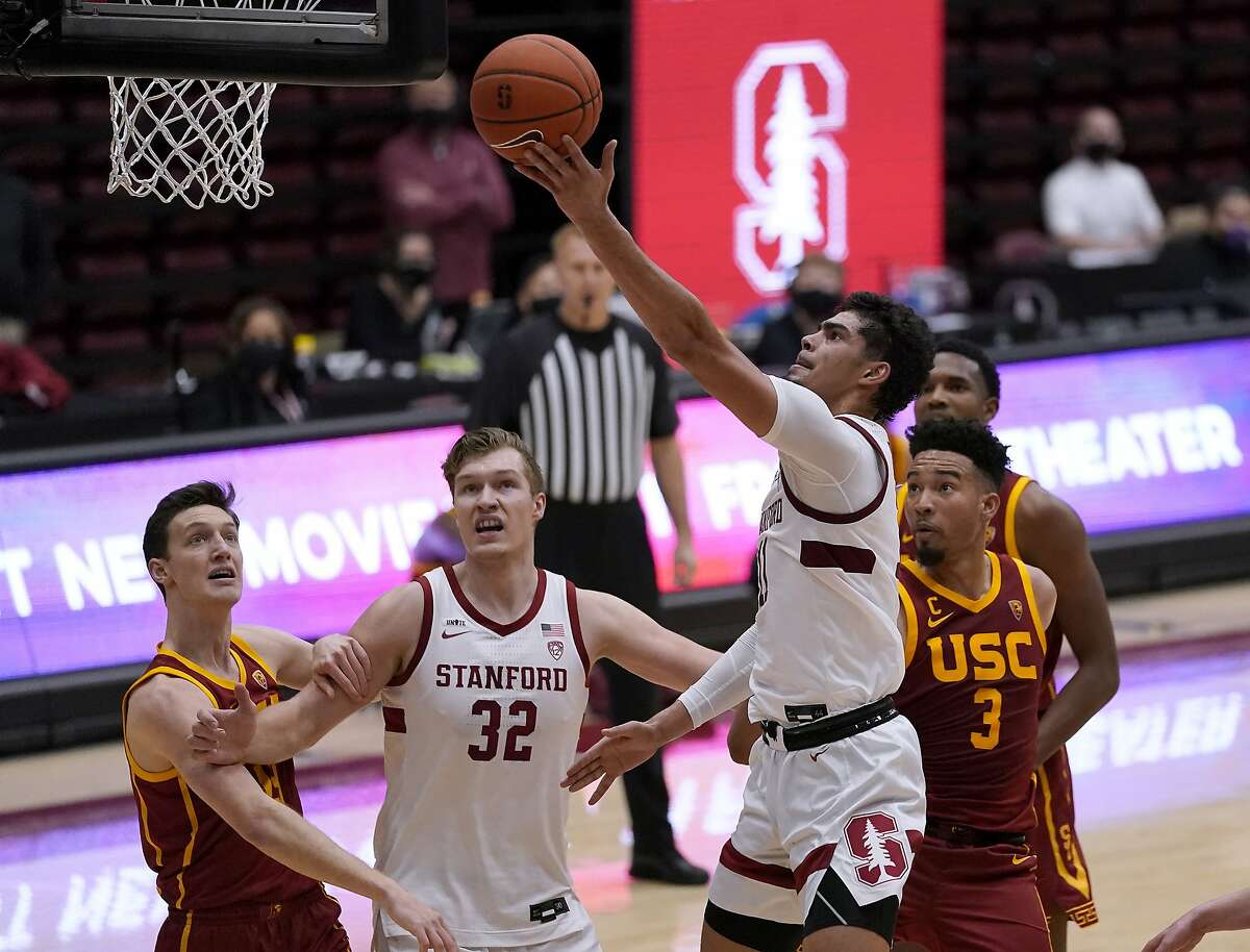 Stanford forward Jaiden Delaire (11) drives to the basket against Southern California forward Isaiah Mobley (3) during the first half of an NCAA college basketball game in Stanford, Calif., Tuesday, Feb. 2, 2021. (AP Photo/Tony Avelar)