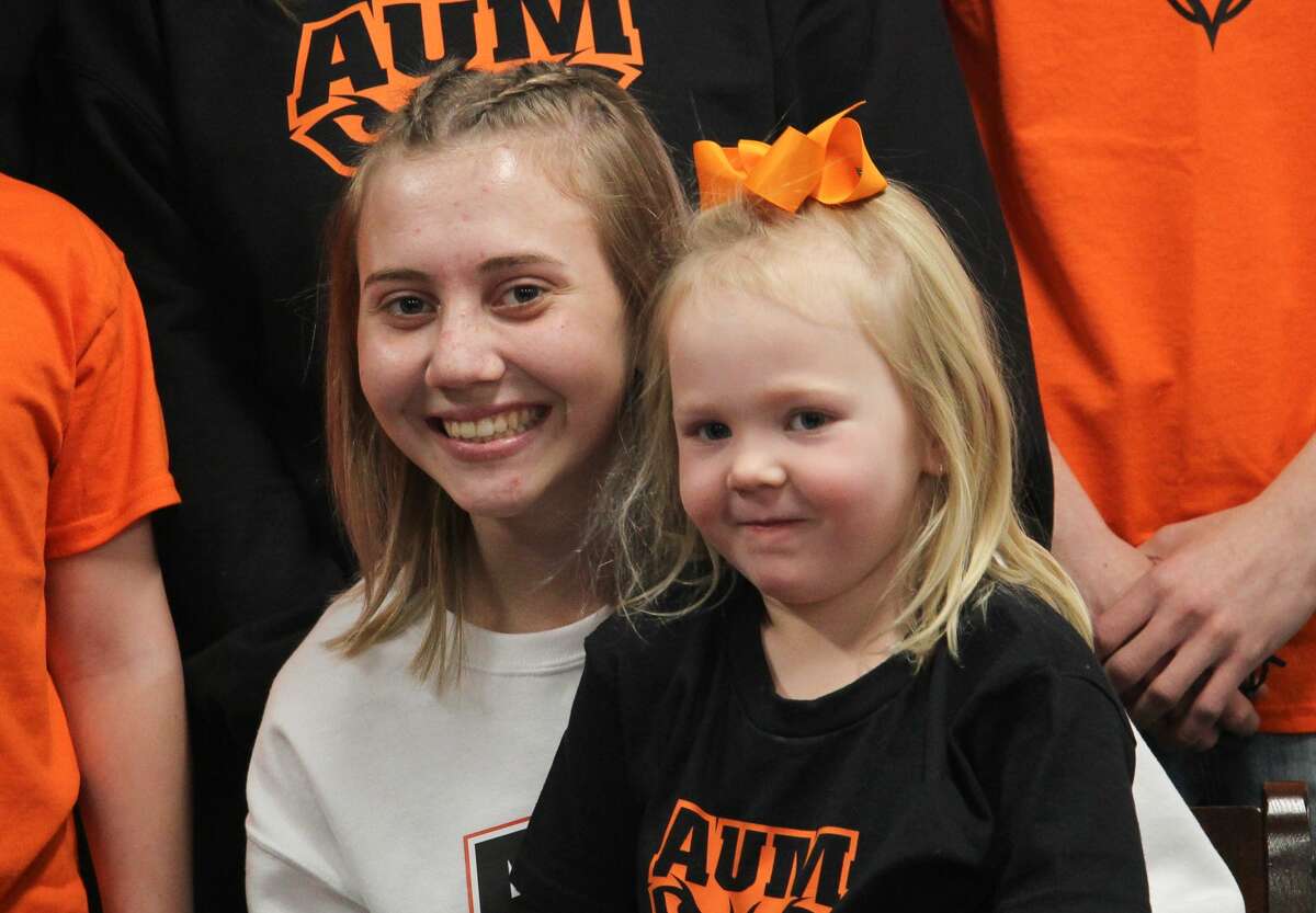 Cass City cross country runner Riley Copeland, surrounded by family and friends,  signed a letter of intent on Tuesday to attend Auburn University at Montgomery.