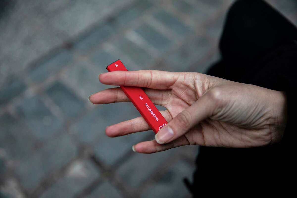 A woman holds a Puff Bar flavored disposable vape device in New York in a previous year. The New Canaan Coalition has launched its 2021 substance abuse campaign, with a focus on vaping. The campaign is utilizing a peer to peer model with educational material designed by New Canaan High School students to educate others about the dangers of vaping.