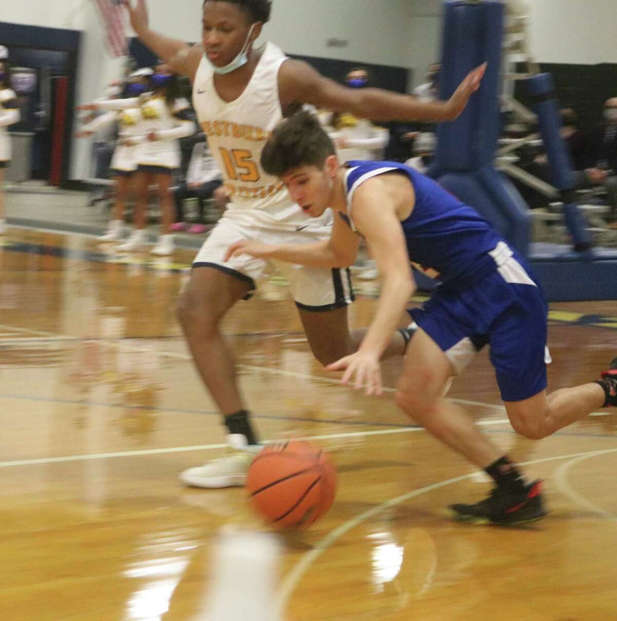 Pasadena-FBCA's Nick Gay hurries to get  the ball up the floor against the defense of Westbury Christian's Jared Duplechin Tuesday night.