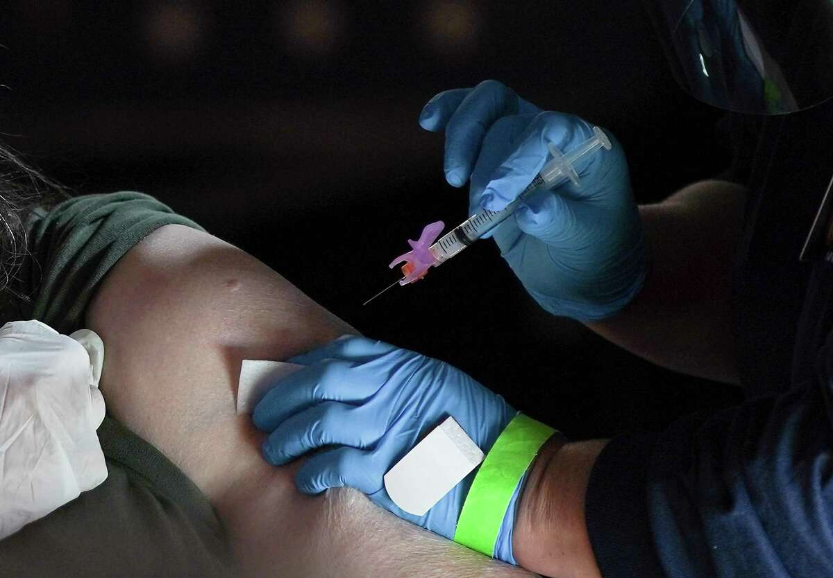 C. Terrell, of Webster, Texas gets her COVID-19 vaccine at Minute Maid Park in Houston on Saturday, Jan. 16, 2021. The mega-distribution site administered 5000 COVID vaccines on Saturday.