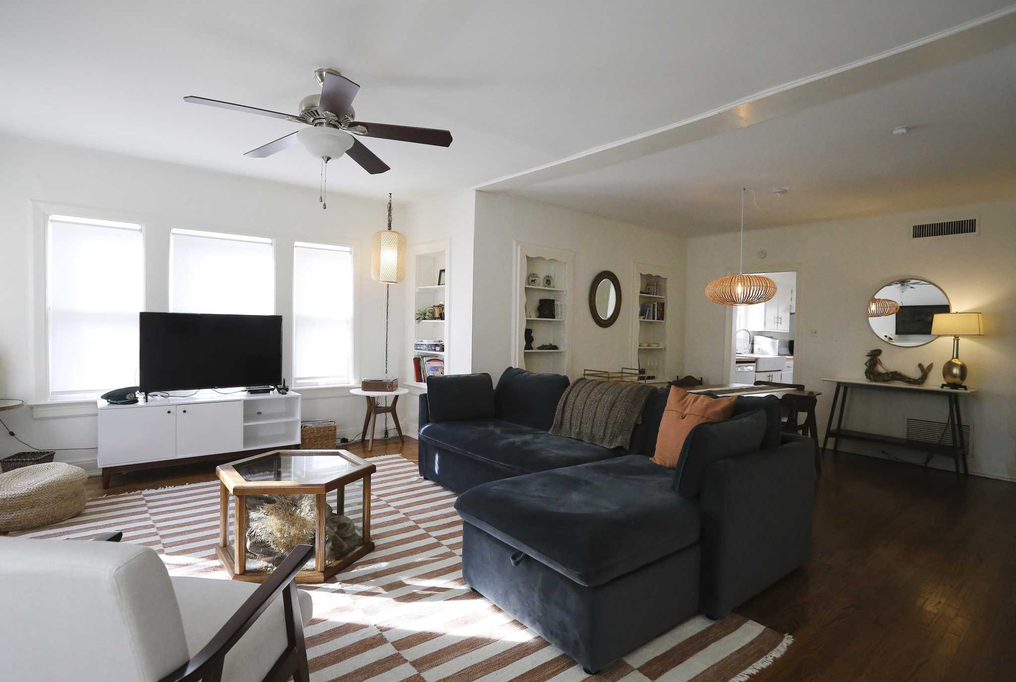 Mahncke Park duplex transformed into luxury Airbnb with a midcenturymeetsbeach house vibe in