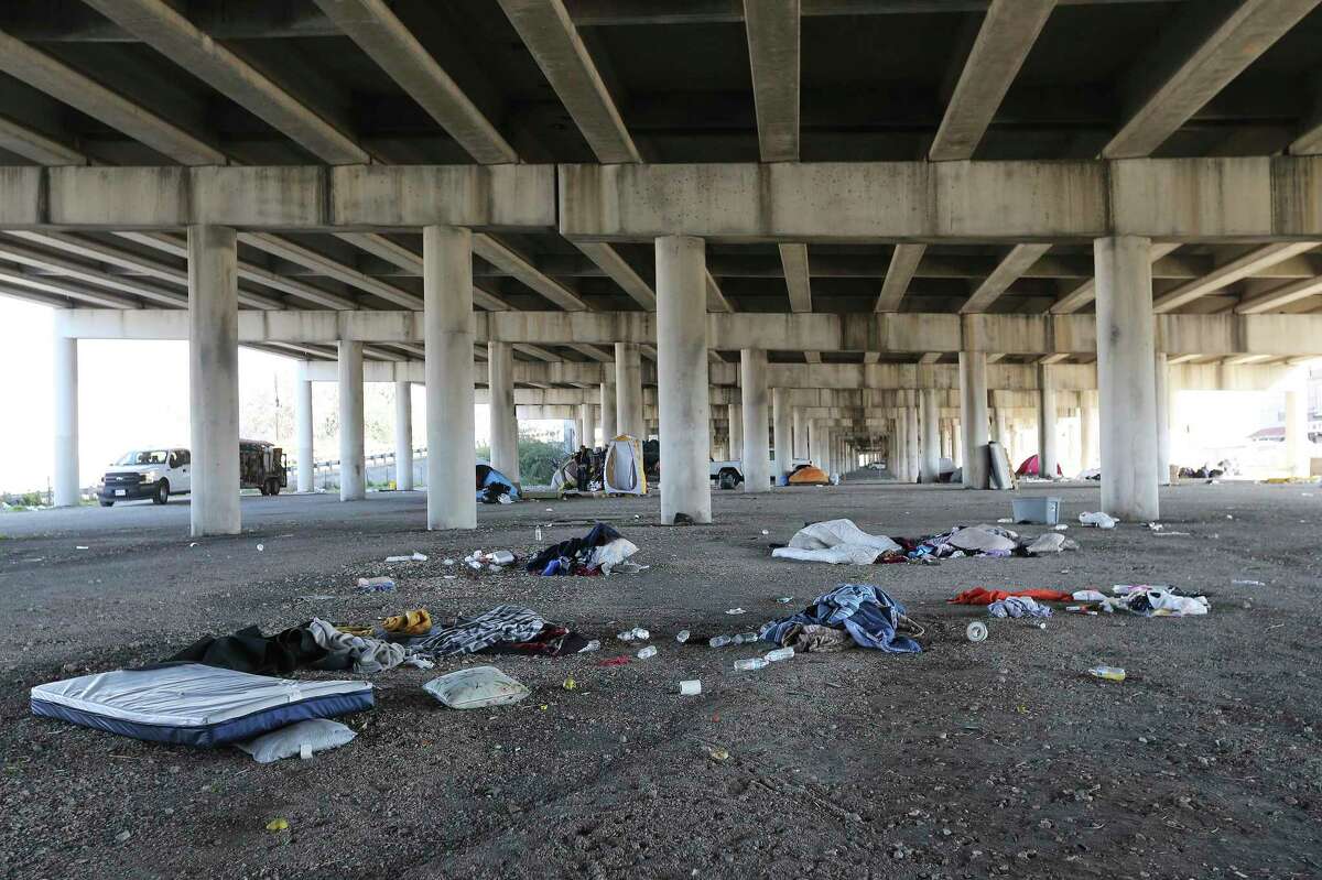 Piles of debris left behind under a highway in downtown San Antonio where nearly 100 homeless people who had set up camp were removed by officials.