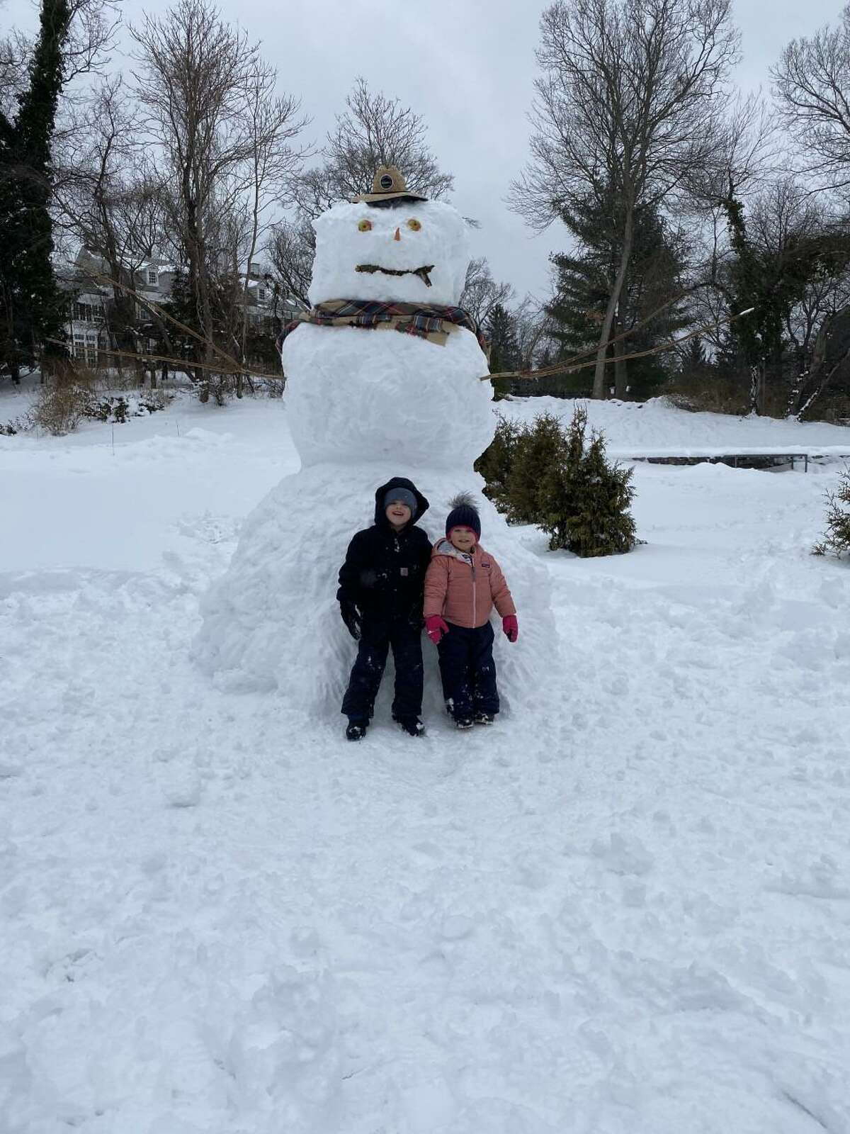 Greyson, 5, and Stella, 2, of Fairfield, made a snowman with the help of their dad during this week's storm.